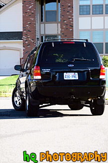 Black SUV Turning Around Corner painting