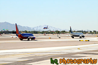 Planes Taxing and Landing at Airport painting