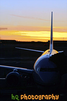 Airplane at Terminal During Sunset painting