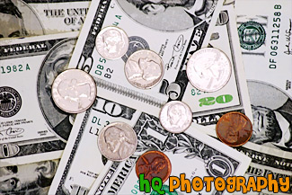 Coins on top of Money Bills painting