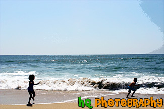 Kids Running Away from Ocean Waves painting