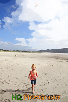 Little Girl Running on Beach with Kite painting