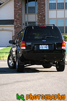 Black SUV Turning Around Corner