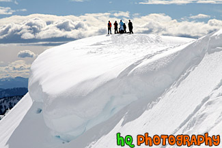 People on Top of Snowy Hill for Snowshoe Trip