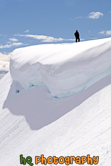 Man Standing Near a Snow Overhang