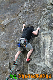 Person Rock Climbing