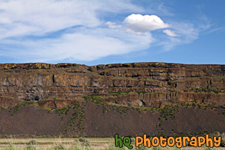 Rock Cliff and Puffy Cloud