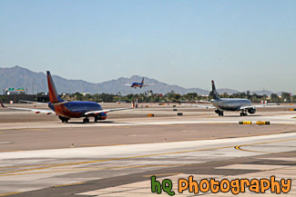 Planes Taxing and Landing at Airport