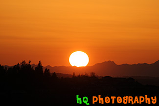 Big Sun Setting Over Olympic Mountains