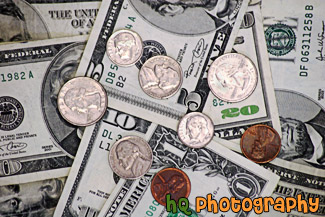 Coins on top of Money Bills