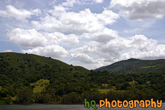 Green Hill, Lake, & Puffy Clouds