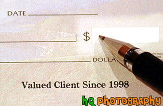 Pen Writing on a Check