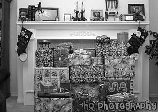 Christmas Presents Under Fire Mantel black and white picture