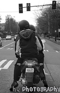 Two People on a Motor Bike black and white picture