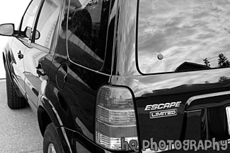 Back End of Ford Escape Limited black and white picture