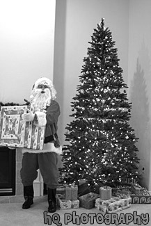 Santa Claus Holding a Present black and white picture