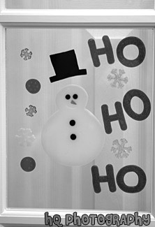 Snowman Decoration on Glass Door black and white picture