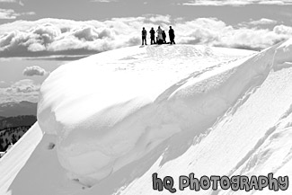 People on Top of Snowy Hill for Snowshoe Trip black and white picture