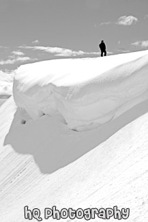 Man Standing Near a Snow Overhang black and white picture