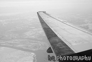 Airplane Wing in the Sky black and white picture