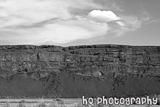 Rock Cliff and Puffy Cloud black and white picture