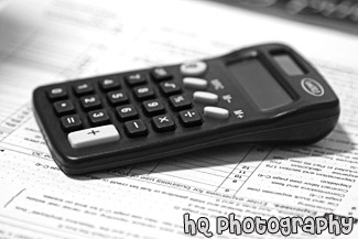 Black Calculator on Tax Forms black and white picture