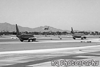 Planes Taxing and Landing at Airport black and white picture