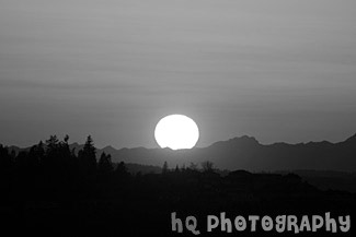 Big Sun Setting Over Olympic Mountains black and white picture