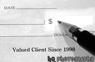 Pen Writing on a Check black and white picture