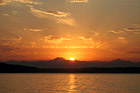 Orange Sunset Behind Olympic Mountains photo thumbnail