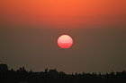 Red Sun During Sunset photo thumbnail