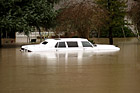 Close Up of White Car in Flood photo thumbnail