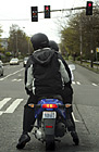 Two People on a Motor Bike photo thumbnail