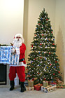 Santa Claus Holding a Present photo thumbnail