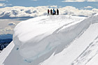 People on Top of Snowy Hill for Snowshoe Trip photo thumbnail