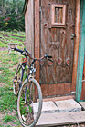 Old Bicycle Leaning Against Shed photo thumbnail