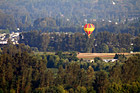 Hot Air Balloon Over Country Land photo thumbnail