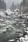 River Flowing Through Snow photo thumbnail