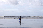 Kid with Bucket on Beach photo thumbnail