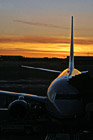 Airplane at Terminal During Sunset photo thumbnail