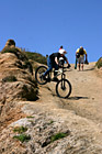 Kid Riding Bike Down a Hill photo thumbnail