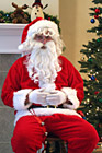 Close Up of Santa Sitting in Chair photo thumbnail