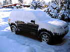 Ford Escape Covered in Snow photo thumbnail