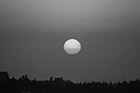 Black & White Red Sun During Sunset preview