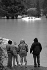 Black & White People Watching Car in Flood preview