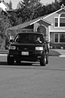 Black & White SUV Driving on Road preview