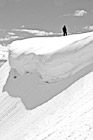 Black & White Man Standing Near a Snow Overhang preview