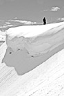 Black & White Man Standing Near a Snow Overhang preview