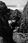 Black & White Ocean Waves Splashing on Rocks preview