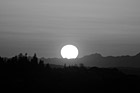 Black & White Big Sun Setting Over Olympic Mountains preview